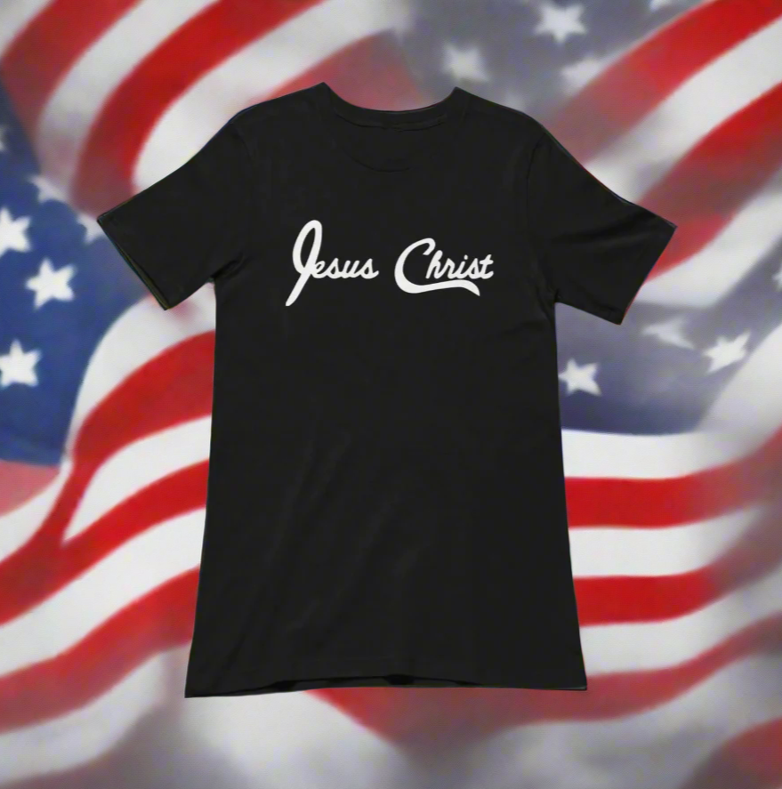 Black t-shirt with 'Jesus Christ' printed in white on an American flag background